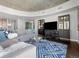 Comfortable living room featuring a large sectional sofa, modern design, and ample space at 891 14Th St # 1109, Denver, CO 80202