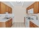 Kitchen features updated cabinets, countertops and appliances at 800 W Belleview Ave # 201, Englewood, CO 80110