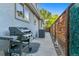 Outdoor grill on a small patio with a wood fence creates a perfect space for backyard entertainment at 566 N Humboldt St, Denver, CO 80218