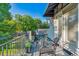 This balcony features wood floors, outdoor seating, and natural light at 566 N Humboldt St, Denver, CO 80218