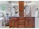 Bright bathroom features a double sink, a large wood vanity, and granite countertops at 566 N Humboldt St, Denver, CO 80218