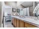 This bathroom features double sinks, natural light, and a tile countertop at 566 N Humboldt St, Denver, CO 80218