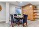 This dining room features carpeted floors, natural light, and a small dining table at 566 N Humboldt St, Denver, CO 80218