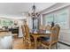 Formal dining room with a chandelier, elegant furnishings, and a view into the living area at 566 N Humboldt St, Denver, CO 80218