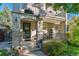 Inviting front entrance with decorative door and a charming porch, enhancing the home's curb appeal at 566 N Humboldt St, Denver, CO 80218