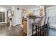 Kitchen featuring light wood cabinets, stainless steel appliances, and a breakfast bar with seating at 566 N Humboldt St, Denver, CO 80218