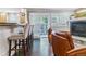 Living room with a kitchen bar, fireplace, and leather chairs at 566 N Humboldt St, Denver, CO 80218