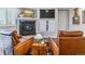 Cozy living room with leather chairs, a fireplace, and built-in storage at 566 N Humboldt St, Denver, CO 80218