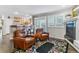 Open-concept living room with a kitchen bar, fireplace, and comfortable leather chairs at 566 N Humboldt St, Denver, CO 80218