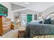 Bright main bedroom with vaulted ceiling, french doors, and a sitting area at 566 N Humboldt St, Denver, CO 80218
