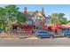 Charming restaurant exterior with outdoor seating, a brick facade, and ample street parking at 566 N Humboldt St, Denver, CO 80218
