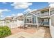 Back exterior showcasing a stone patio and charming curb appeal at 11386 Grove St # B, Westminster, CO 80031