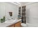 Cozy bathroom featuring a shower-tub combination and vanity at 11386 Grove St # B, Westminster, CO 80031