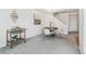 Bright dining area features elegant chandelier, decorative bar cart, and contemporary decor at 11386 Grove St # B, Westminster, CO 80031