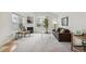 Bright living room with large windows, fireplace, and comfortable seating at 11386 Grove St # B, Westminster, CO 80031