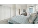 Bright main bedroom features sliding closet doors and a balcony at 11386 Grove St # B, Westminster, CO 80031