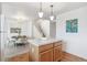 Open floorplan features hardwood kitchen, dining area and living room space with lots of natural light at 11386 Grove St # B, Westminster, CO 80031