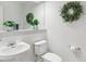Modern half-bathroom features stylish fixtures, clean lines, and tastefully chosen décor at 11386 Grove St # B, Westminster, CO 80031