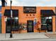 View of Adelitas Cocina Y Cantina restaurant with painted murals on the exterior at 1960 S Sherman St, Denver, CO 80210