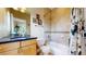 Bathroom featuring a vanity with a sink and a shower-tub combo at 1960 S Sherman St, Denver, CO 80210