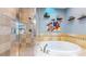 Relaxing bathroom with glass shower and a soaking tub at 1960 S Sherman St, Denver, CO 80210