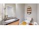 Powder room featuring a granite countertop, a modern faucet, and a decorative shelf at 1960 S Sherman St, Denver, CO 80210