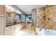 Long bathroom featuring double vanity, glass shower, and soaking tub at 1960 S Sherman St, Denver, CO 80210