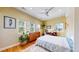 Bright bedroom featuring hardwood floors, natural light, and a ceiling fan at 1960 S Sherman St, Denver, CO 80210