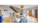 Dining room showcases an open staircase and a wood table with modern white chairs at 1960 S Sherman St, Denver, CO 80210