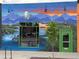 Unique exterior of a building with a mural and green door and trim, adding to the building's artistic appeal at 1960 S Sherman St, Denver, CO 80210