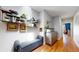 Hallway with storage bench and decorative shelving with plants at 1960 S Sherman St, Denver, CO 80210