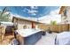 Backyard with a hot tub, perfect for relaxation, featuring a seating area and privacy fence at 1960 S Sherman St, Denver, CO 80210