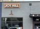 Exterior view of the Joy Hill restaurant sign on a brick building at 1960 S Sherman St, Denver, CO 80210