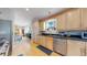 Well-equipped kitchen with stainless steel appliances, dark countertops, and wooden cabinetry at 1960 S Sherman St, Denver, CO 80210