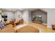 Spacious living area featuring hardwood floors and a large television at 1960 S Sherman St, Denver, CO 80210