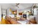 The living room features a fireplace, leather sofa, and an open concept to the kitchen at 1960 S Sherman St, Denver, CO 80210