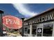 Sweet Cow storefront with an Old South Pearl Street sign against a blue sky at 1960 S Sherman St, Denver, CO 80210