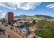Scenic city view overlooking buildings, streets, and distant mountains under a bright, cloudy sky at 2711 Mapleton Ave # 1, Boulder, CO 80304
