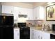 Bright kitchen featuring white cabinets and stainless steel appliances at 2711 Mapleton Ave # 1, Boulder, CO 80304