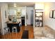 Open concept living room with kitchen, island and hardwood flooring at 2711 Mapleton Ave # 1, Boulder, CO 80304