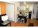 Cozy living room with kitchen view and hardwood flooring at 2711 Mapleton Ave # 1, Boulder, CO 80304