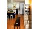 Open concept living room with kitchen, island and hardwood flooring at 2711 Mapleton Ave # 1, Boulder, CO 80304