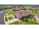 Aerial view of a single-Gathering home featuring professional landscaping, a brown roof, and a two-car garage at 25019 E Alder Dr, Aurora, CO 80016