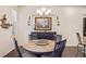 Charming dining room with stylish chandelier and custom decor at 25019 E Alder Dr, Aurora, CO 80016