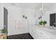 Modern bathroom with double vanity, decorative mirrors, and modern lighting at 5320 Lowell Blvd, Denver, CO 80221