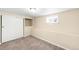 Carpeted basement bedroom with window and closet space, providing a private retreat at 3123 N Elizabeth St, Denver, CO 80205