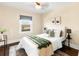 Cozy bedroom with natural light, neutral walls, hardwood floors, and modern decor at 3123 N Elizabeth St, Denver, CO 80205