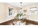 Bright dining room featuring modern lighting and a glass-top table at 3123 N Elizabeth St, Denver, CO 80205