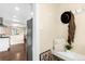 Charming entryway with a bench, pillows, and decorative hat and scarf on hooks at 3123 N Elizabeth St, Denver, CO 80205