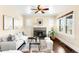 Cozy living room with fireplace, hardwood floors, and plenty of natural light at 3123 N Elizabeth St, Denver, CO 80205